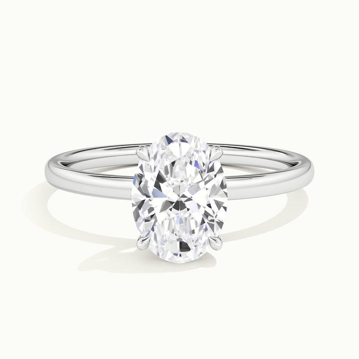 White gold oval-cut solitaire engagement ring, front view
