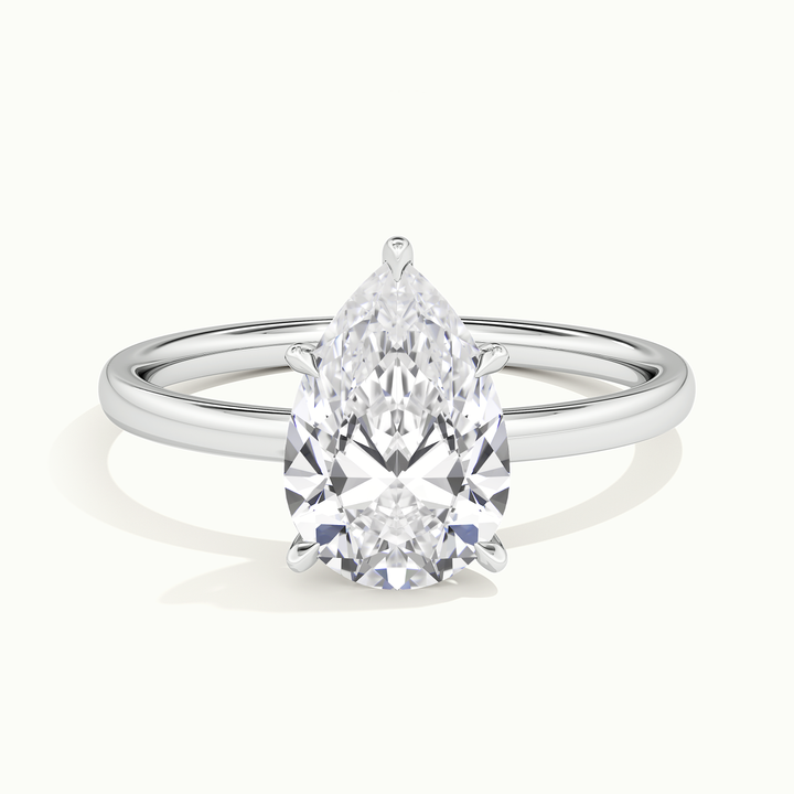 White gold pear-cut low profile solitaire engagement ring, front view