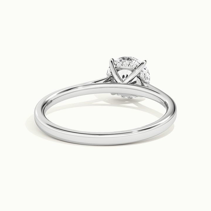 White gold round brilliant-cut cathedral hidden halo engagement ring, rear view showing the setting gallery