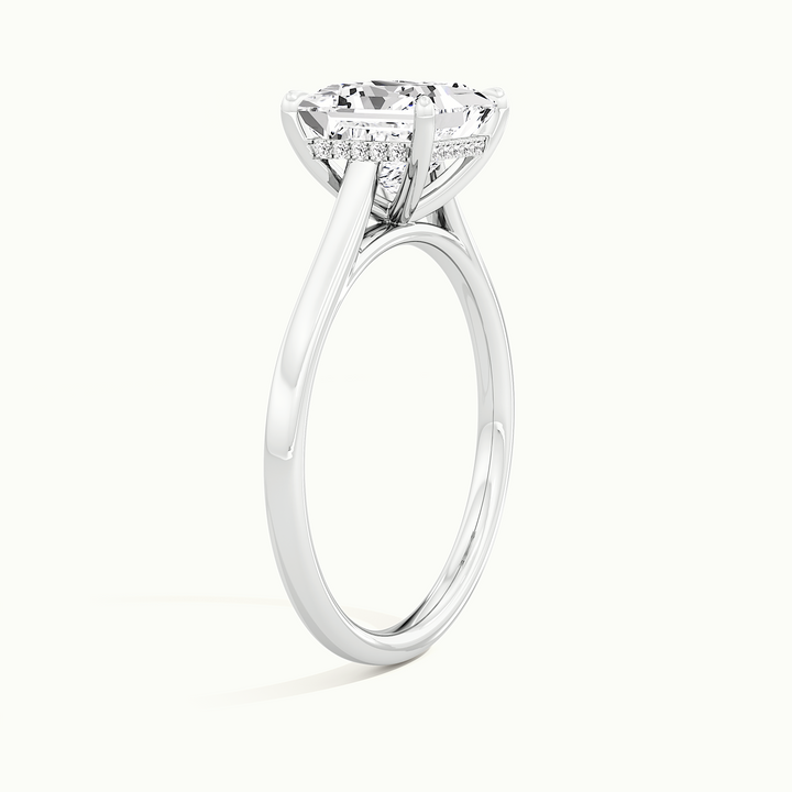 White gold princess-cut cathedral hidden halo engagement ring, raised three-quarter view of the setting
