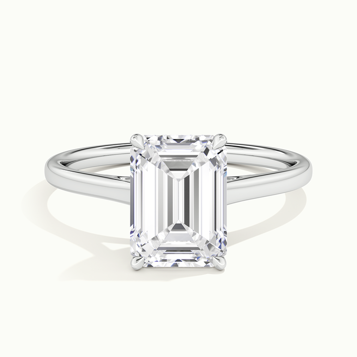 White gold emerald-cut cathedral solitaire engagement ring, front view