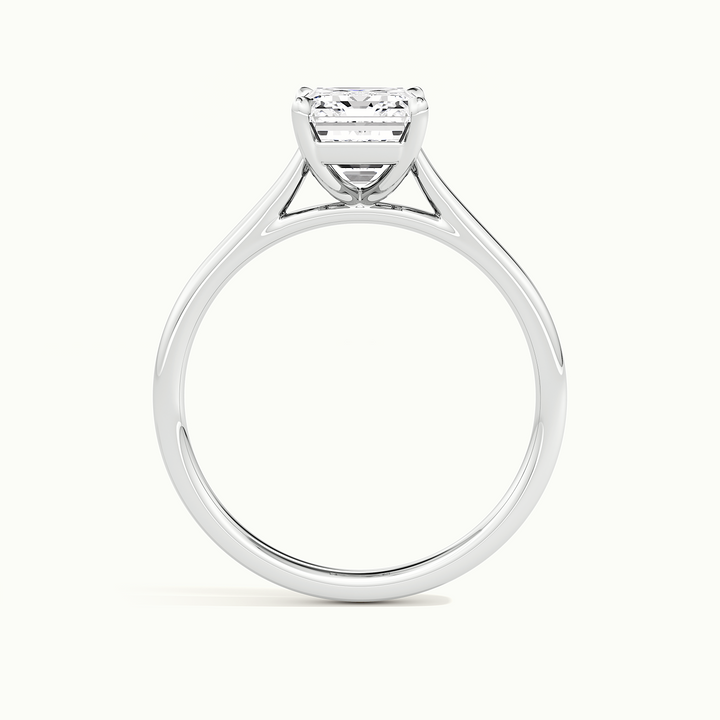 White gold emerald-cut cathedral solitaire engagement ring, side profile showing setting height