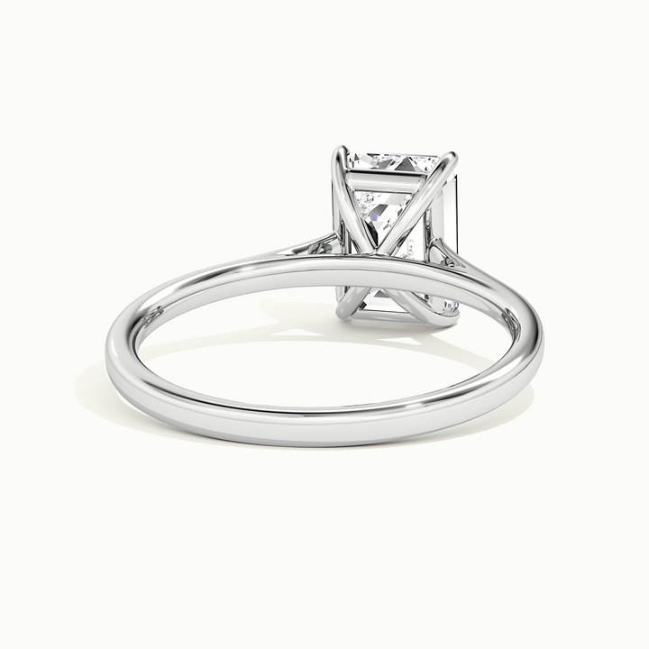 White gold emerald-cut cathedral solitaire engagement ring, rear view showing the setting gallery