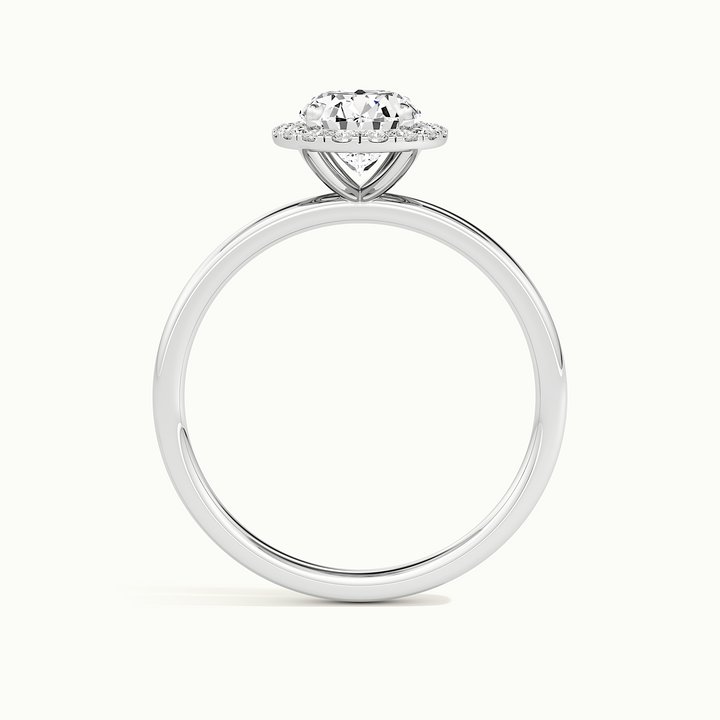 White gold oval-cut halo engagement ring, side profile showing setting height