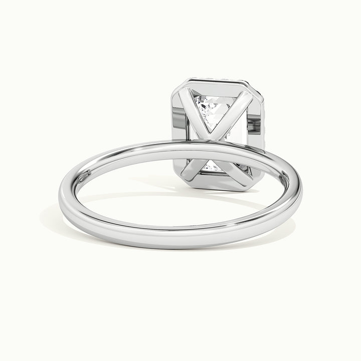 White gold emerald-cut halo engagement ring, rear view showing the setting gallery