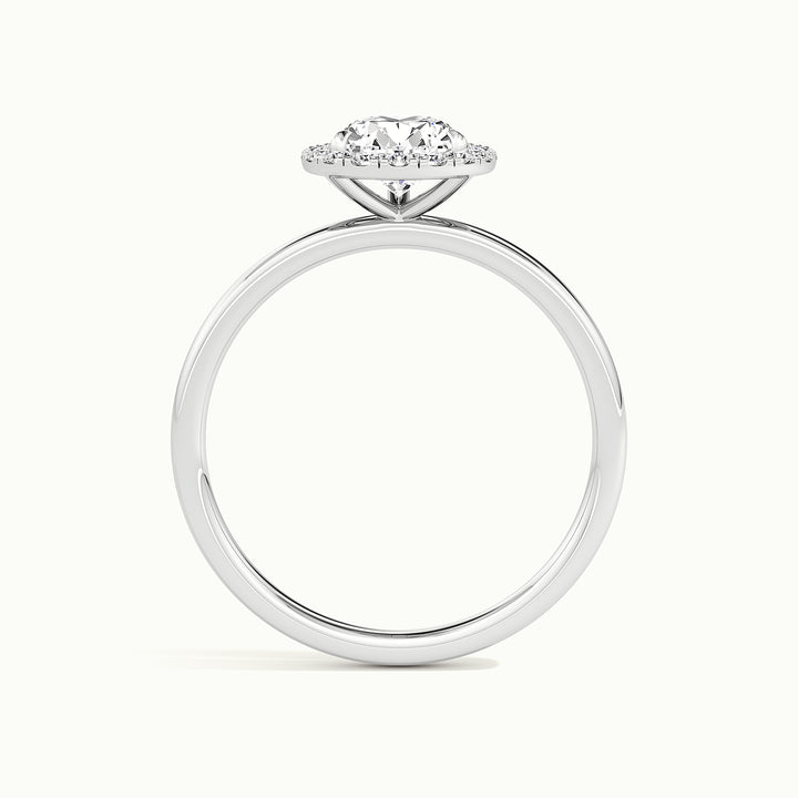 White gold pear-cut halo engagement ring, side profile showing setting height