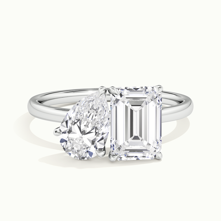 White gold toi et moi pear-and-emerald two-stone engagement ring, front view