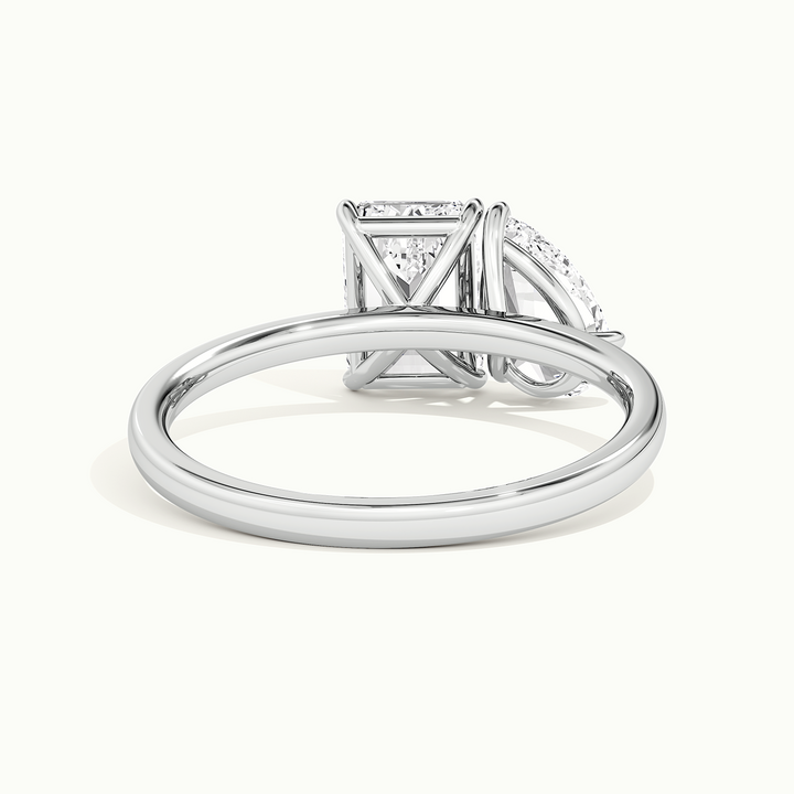 White gold toi et moi pear-and-emerald two-stone engagement ring, side profile showing setting height