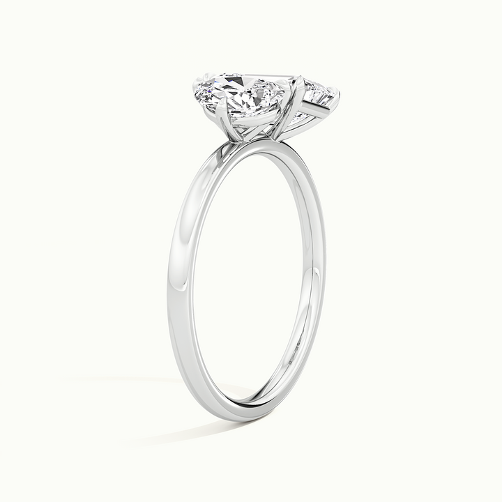 White gold toi et moi pear-and-emerald two-stone engagement ring, rear view showing the setting gallery
