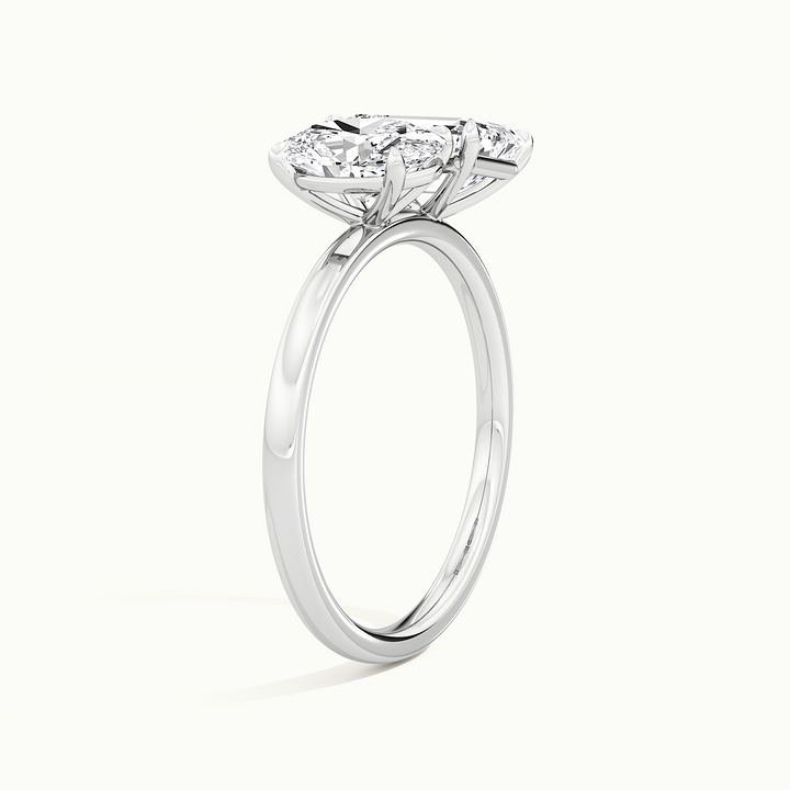 White gold toi et moi oval-and-emerald two-stone engagement ring, rear view showing the setting gallery
