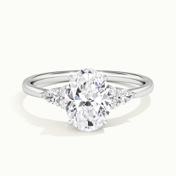 White gold oval-cut three-stone engagement ring, front view