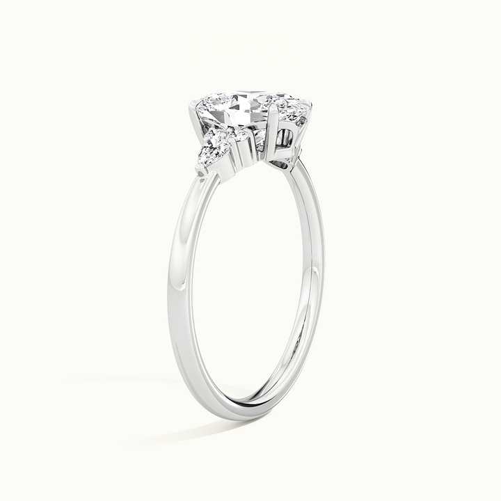 White gold oval-cut three-stone engagement ring, raised three-quarter view of the setting