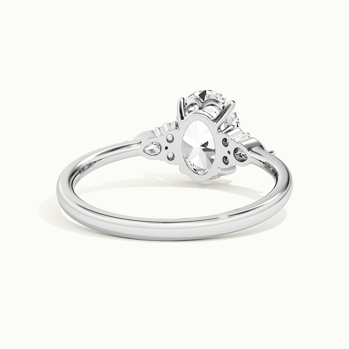 White gold oval-cut three-stone engagement ring, rear view showing the setting gallery