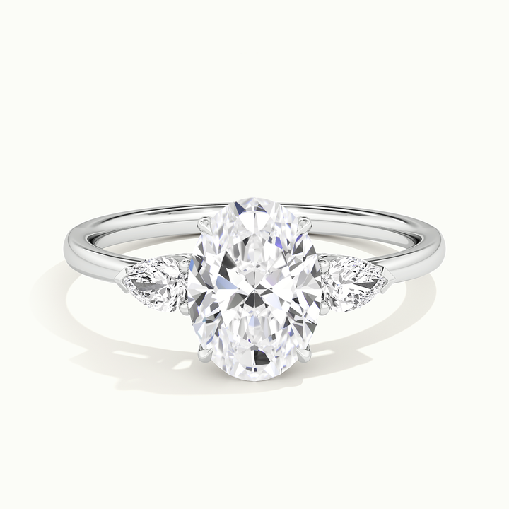 White gold oval-cut three-stone engagement ring, front view