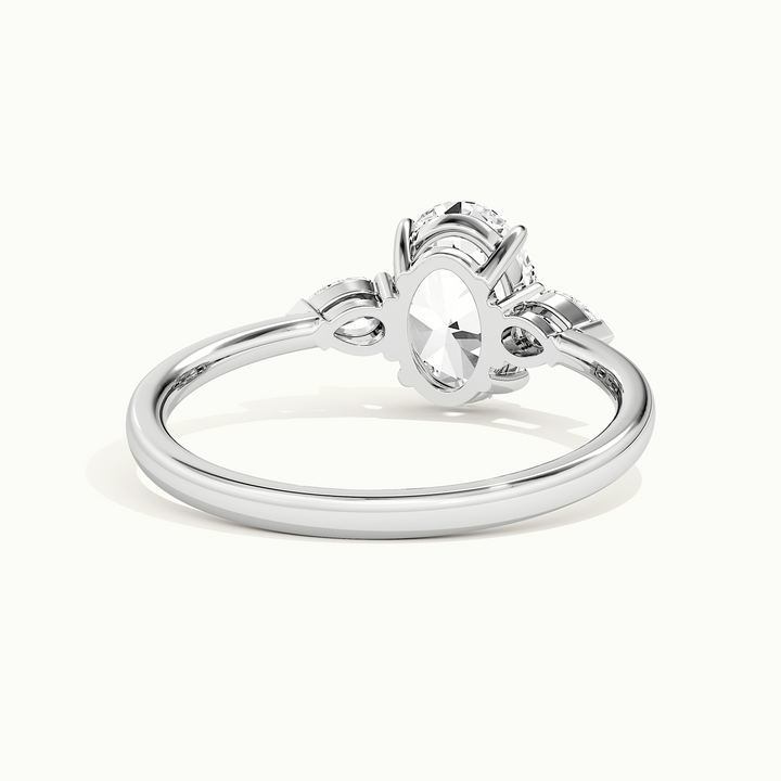 White gold oval-cut three-stone engagement ring, rear view showing the setting gallery