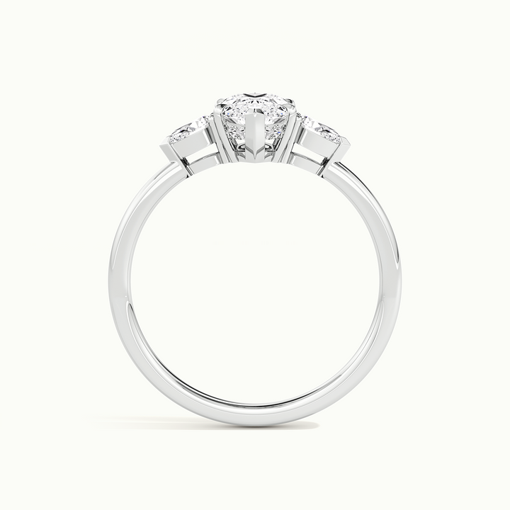 White gold marquise-cut three-stone engagement ring, side profile showing setting height