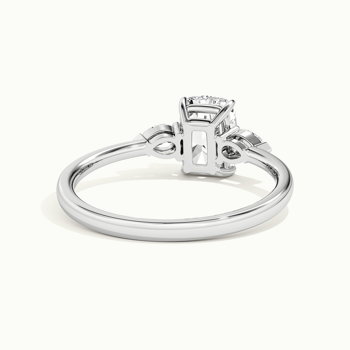White gold elongated cushion-cut three-stone engagement ring, rear view showing the setting gallery