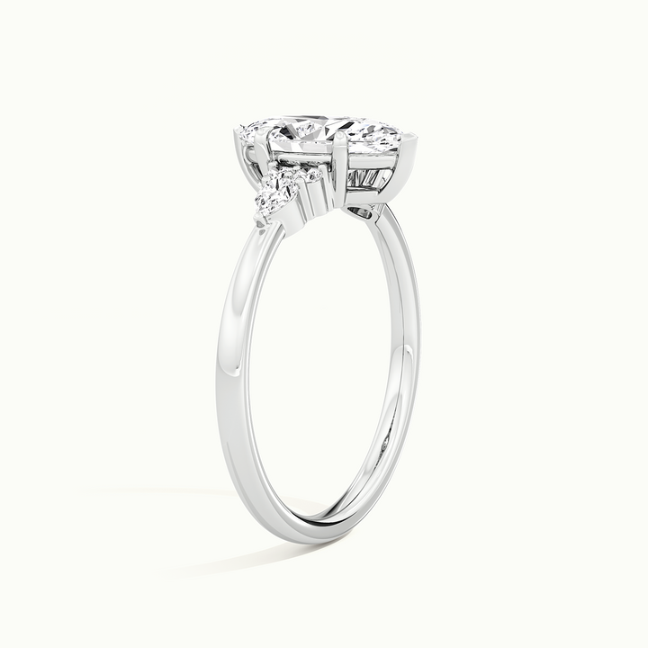 White gold marquise-cut three-stone engagement ring, raised three-quarter view of the setting