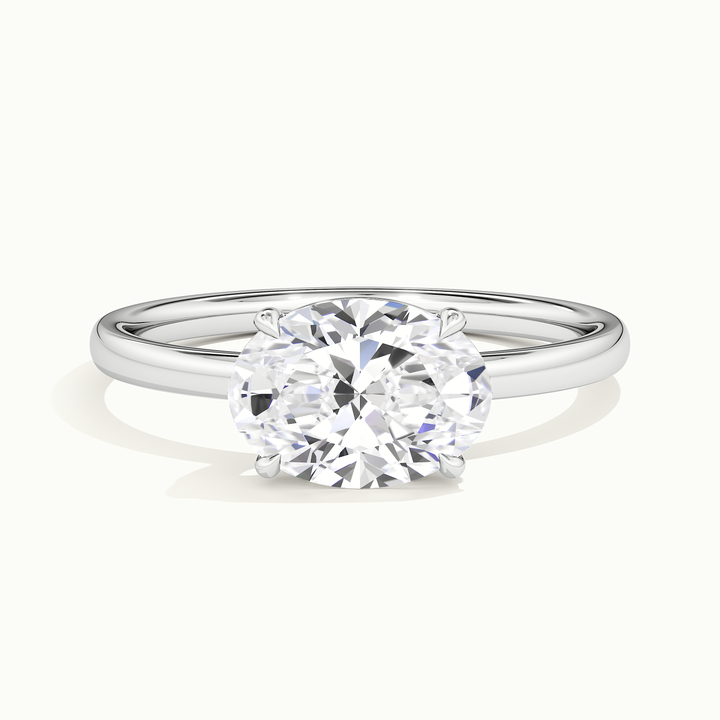 White gold oval-cut east-west solitaire engagement ring, front view