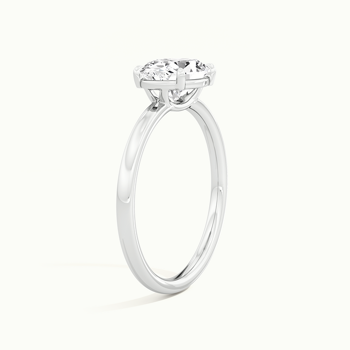 White gold oval-cut east-west solitaire engagement ring, raised three-quarter view of the setting