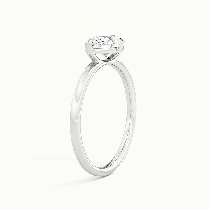 White gold marquise-cut east-west solitaire engagement ring, raised three-quarter view of the setting