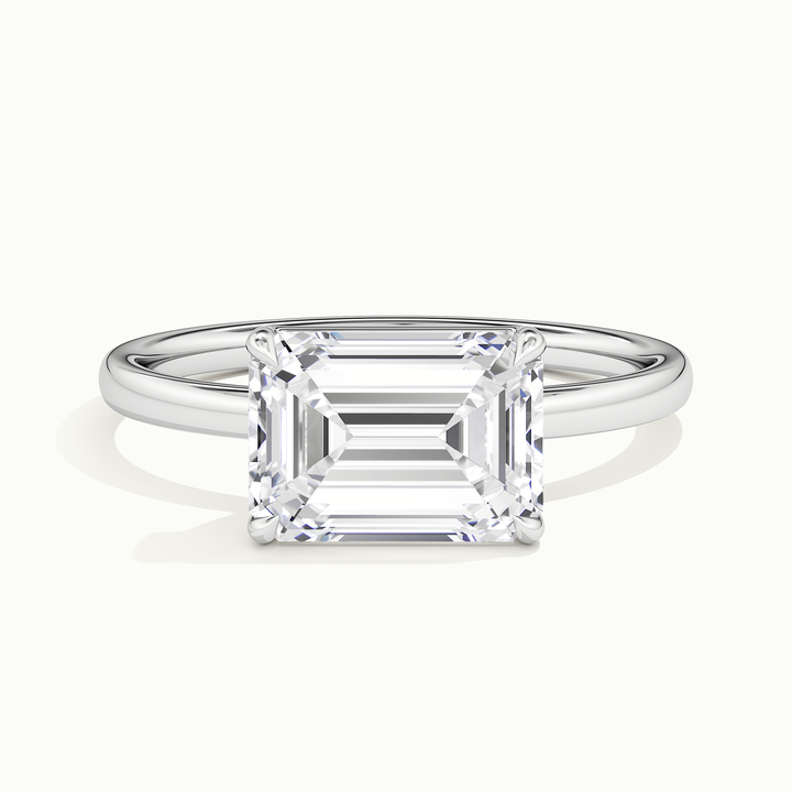 White gold emerald-cut east-west solitaire engagement ring, front view