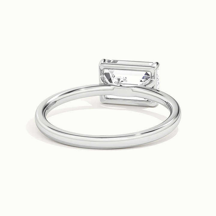 White gold emerald-cut east-west solitaire engagement ring, rear view showing the setting gallery