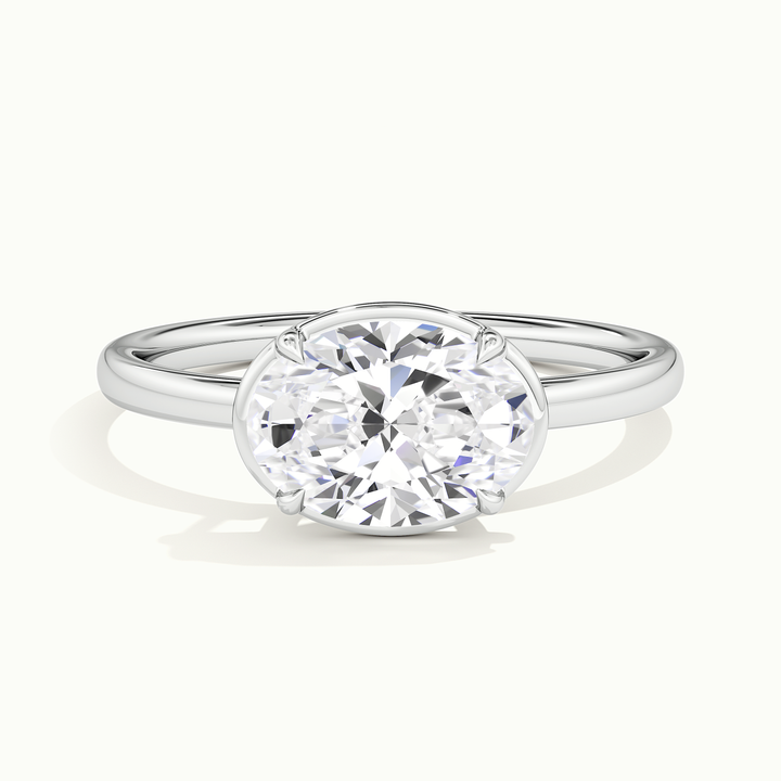 White gold oval-cut east-west bezel-frame solitaire engagement ring, front view