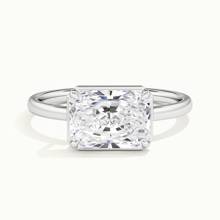 White gold radiant-cut east-west bezel-frame solitaire engagement ring, front view