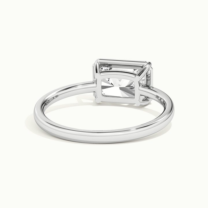 White gold radiant-cut east-west bezel-frame solitaire engagement ring, rear view showing the setting gallery