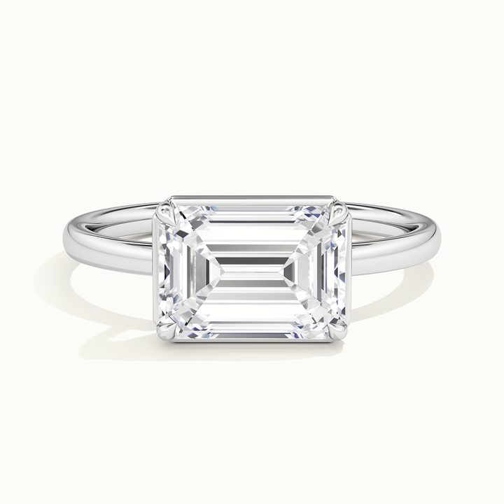 White gold emerald-cut east-west bezel-frame solitaire engagement ring, front view