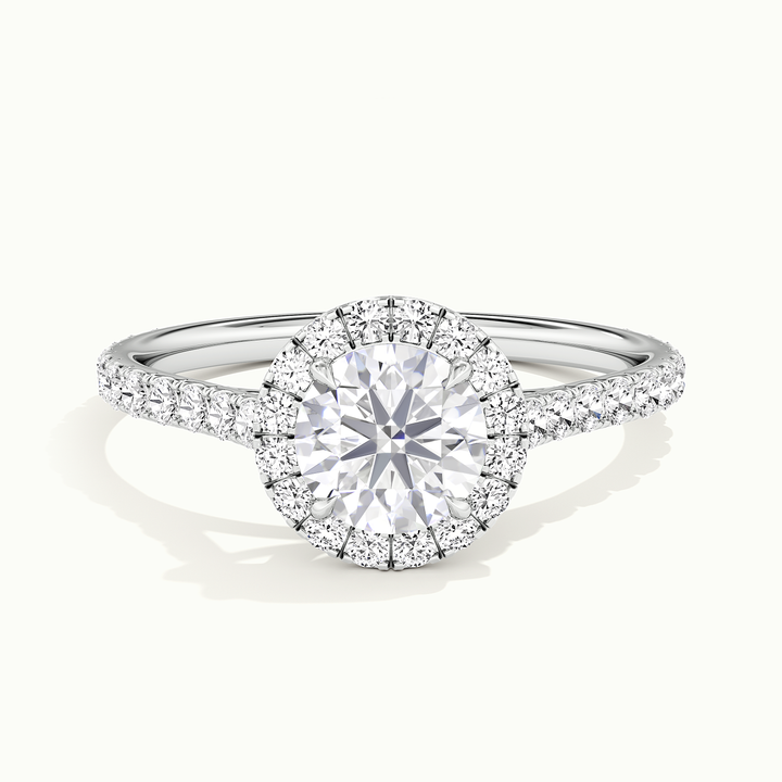 White gold round brilliant-cut halo pave engagement ring, front view