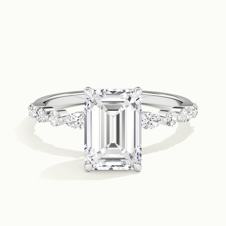 White gold emerald-cut hidden halo with marquise and round side stones, front view