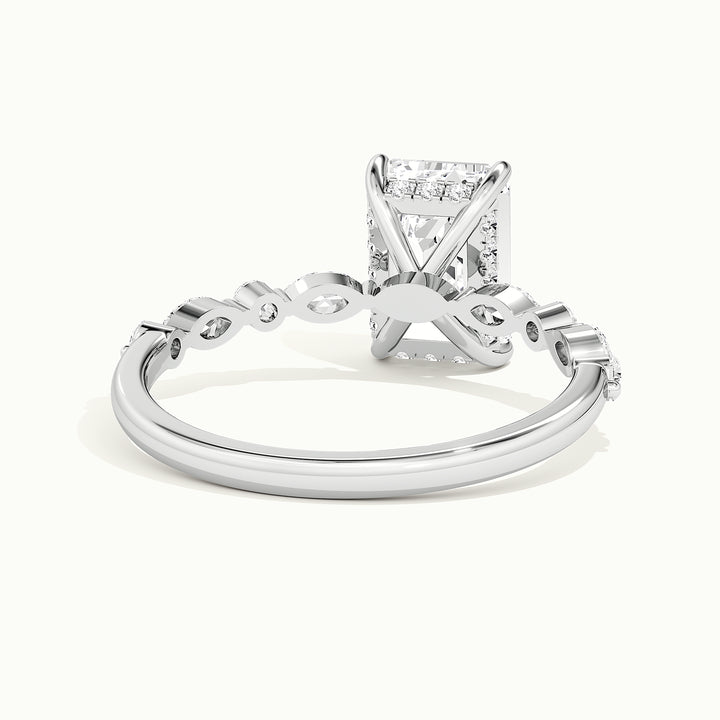 White gold emerald-cut hidden halo with marquise and round side stones, rear view showing the setting gallery