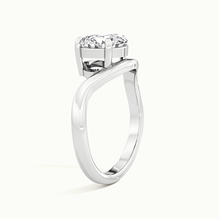 White gold pear-cut east-west solitaire engagement ring, raised three-quarter view of the setting