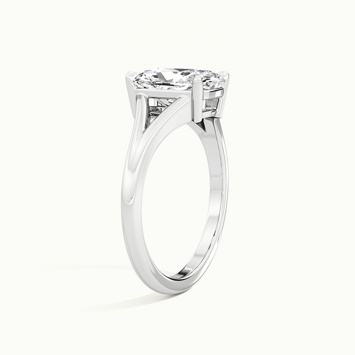 White gold elongated cushion-cut split shank engagement ring, raised three-quarter view of the setting
