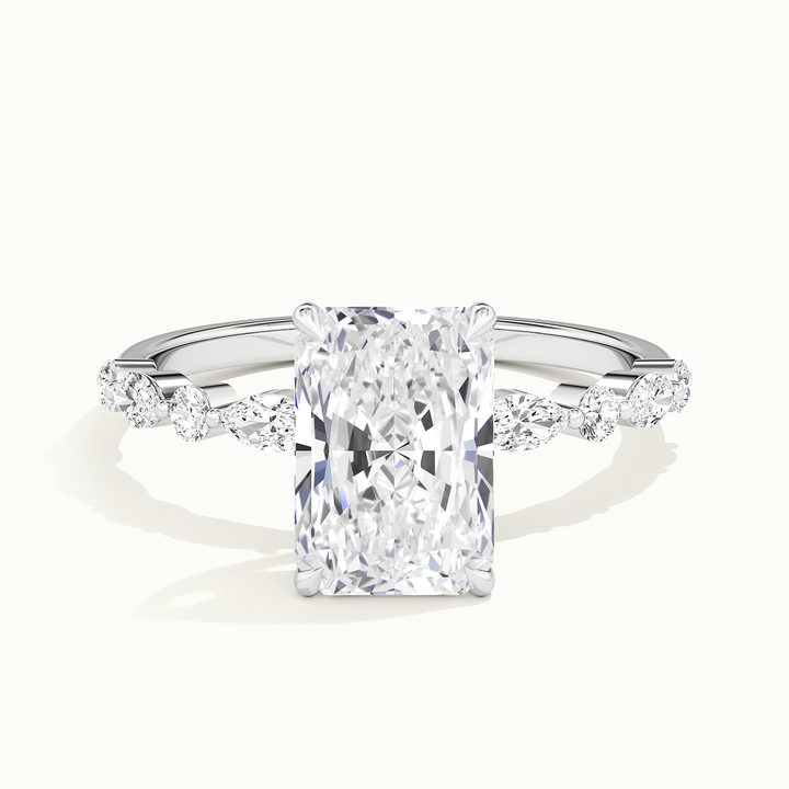 White gold radiant-cut hidden halo with marquise and round side stones, front view