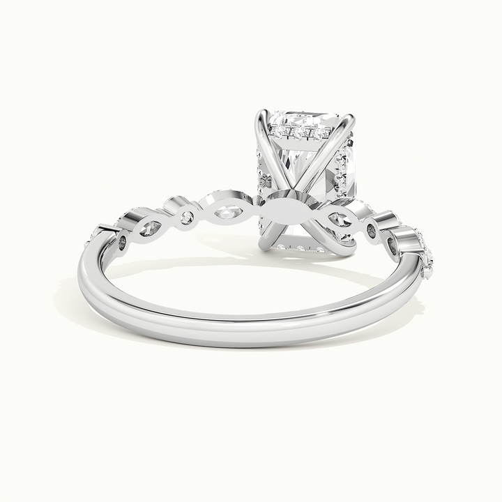 White gold radiant-cut hidden halo with marquise and round side stones, rear view showing the setting gallery