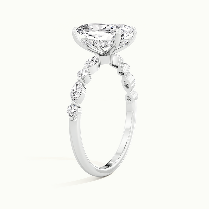 White gold elongated cushion-cut hidden halo with marquise and round side stones, raised three-quarter view of the setting