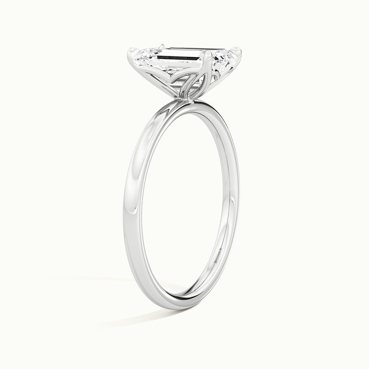 White gold emerald-cut tulip setting engagement ring, raised three-quarter view of the setting