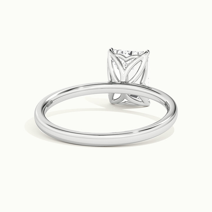 White gold emerald-cut tulip setting engagement ring, rear view showing the setting gallery