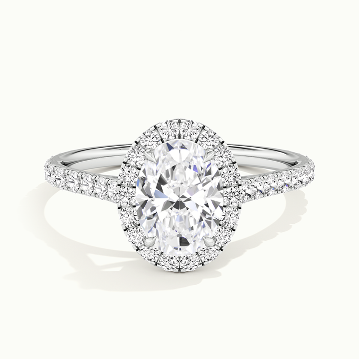 White gold oval-cut halo pave engagement ring, front view