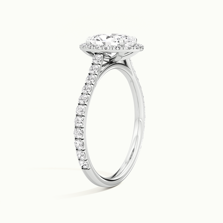 White gold oval-cut halo pave engagement ring, raised three-quarter view of the setting