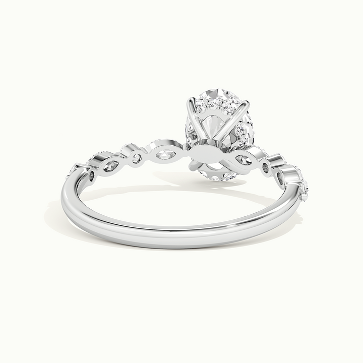 White gold oval-cut hidden halo with marquise and round side stones, rear view showing the setting gallery
