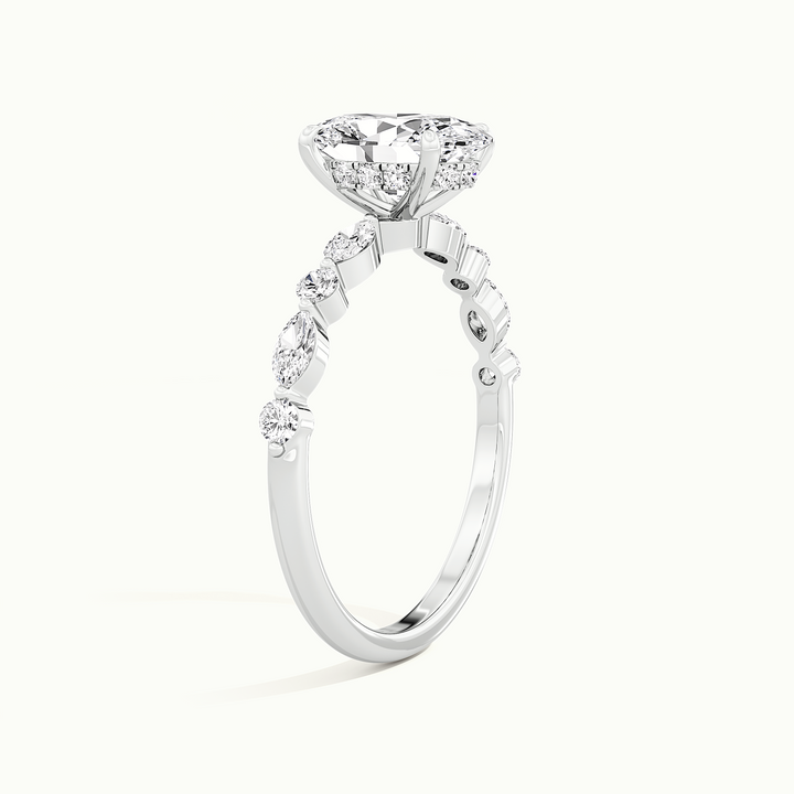 White gold oval-cut hidden halo with marquise and round side stones, raised three-quarter view of the setting