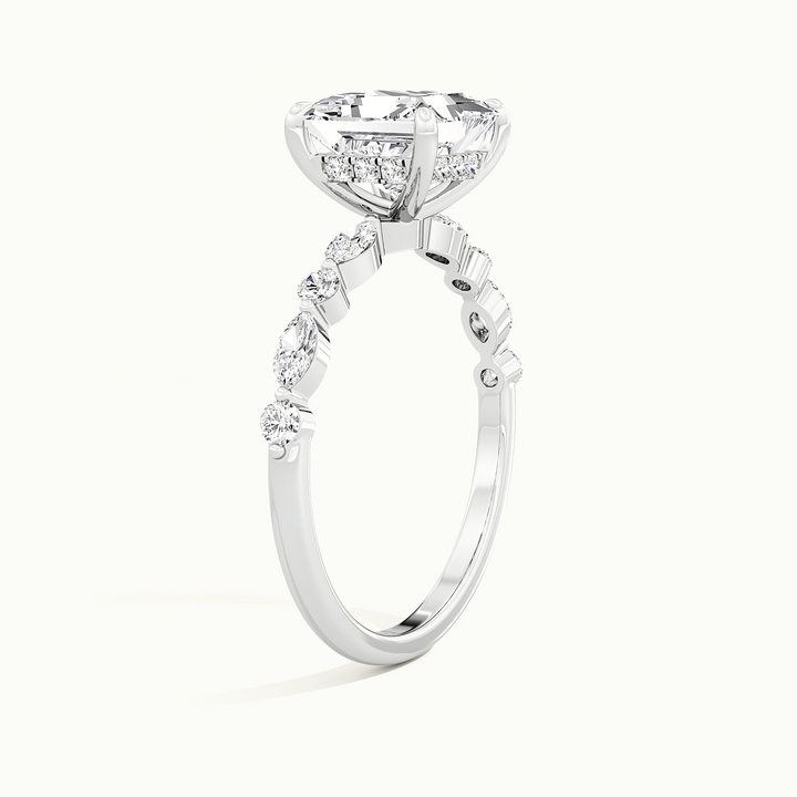 White gold princess-cut hidden halo with marquise and round side stones, raised three-quarter view of the setting
