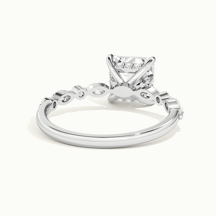White gold princess-cut hidden halo with marquise and round side stones, rear view showing the setting gallery