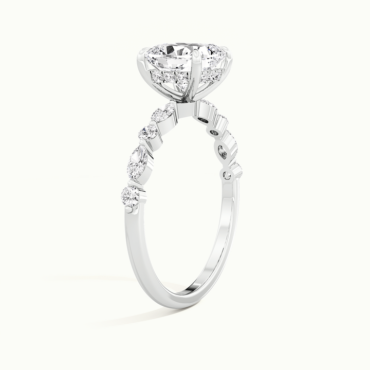 White gold cushion-cut hidden halo with marquise and round side stones, raised three-quarter view of the setting