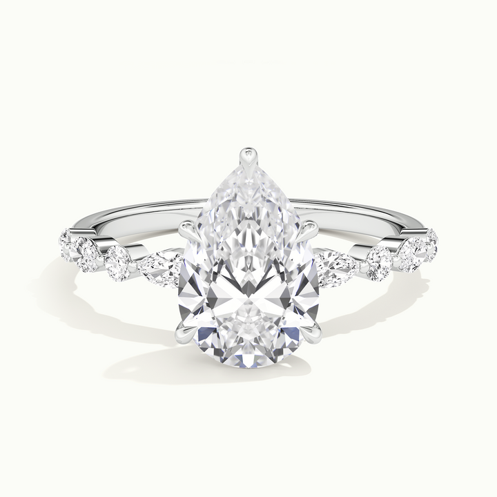 White gold pear-cut hidden halo with marquise and round side stones, front view