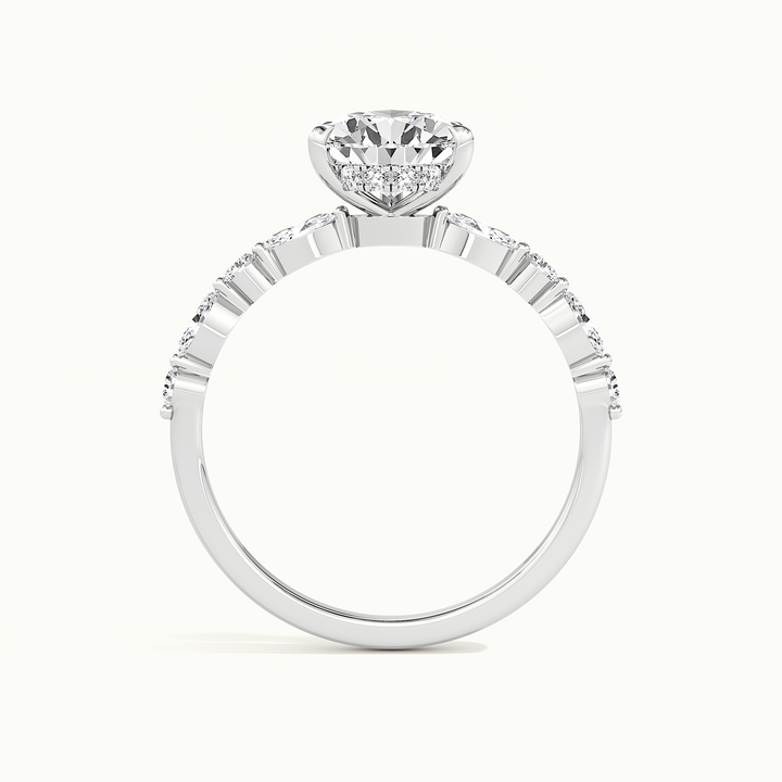 White gold pear-cut hidden halo with marquise and round side stones, side profile showing setting height